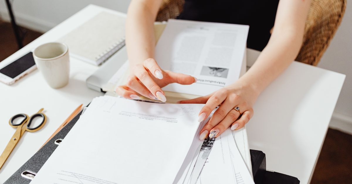 a girl organizing a ton of paper files