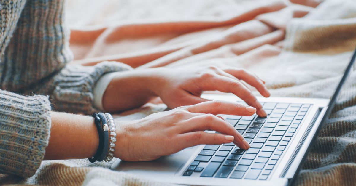 a girl writing on a cozy place