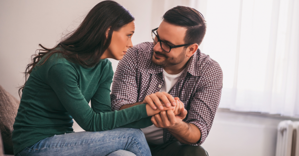 a man consoling a woman