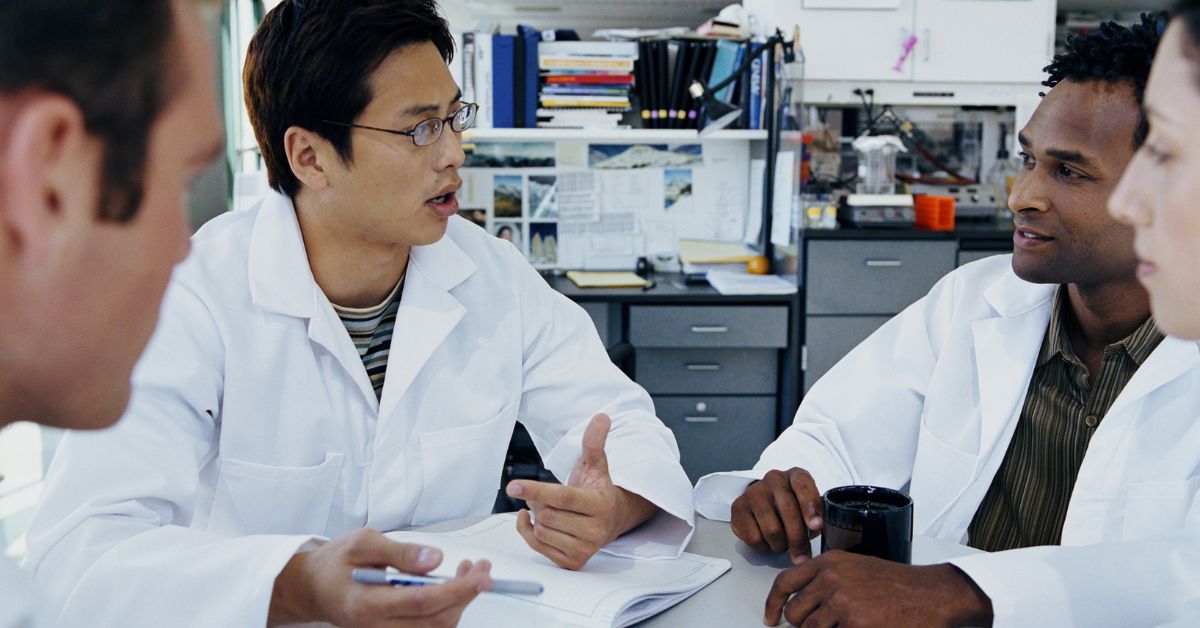 doctors discussing a paper together