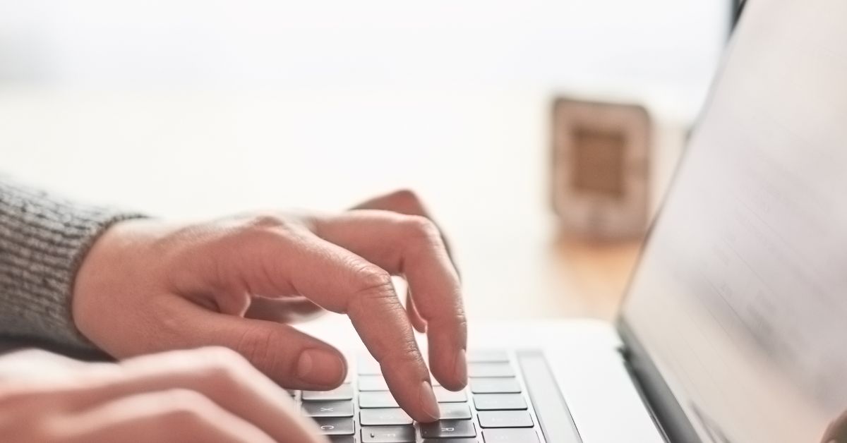 a man registering online in his desk