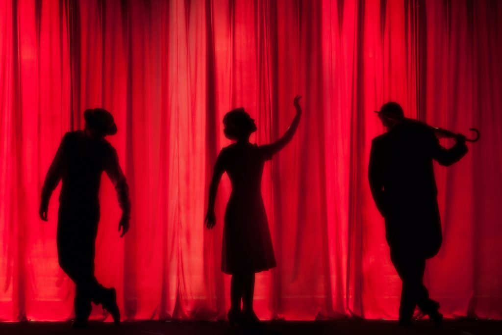 Actors on the stage. Photo via Unsplash.
