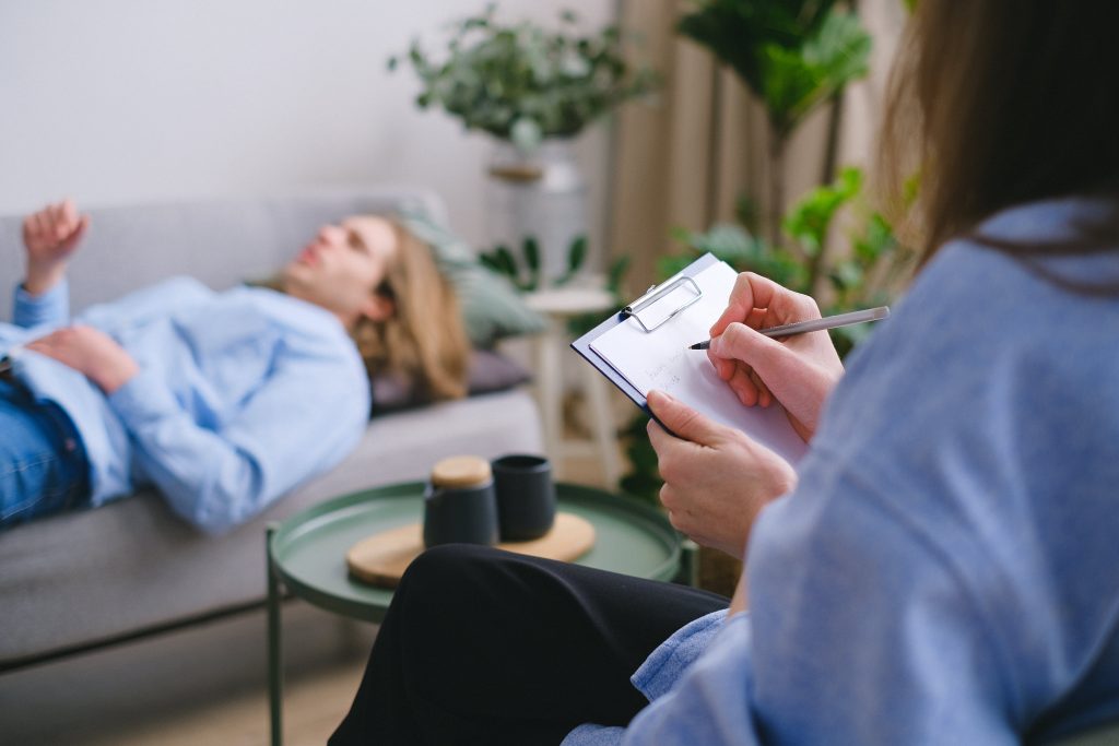 ALT TEXT: Woman offering 90-day drug treatment to her patient. Photo by SHVETS production via Pexels