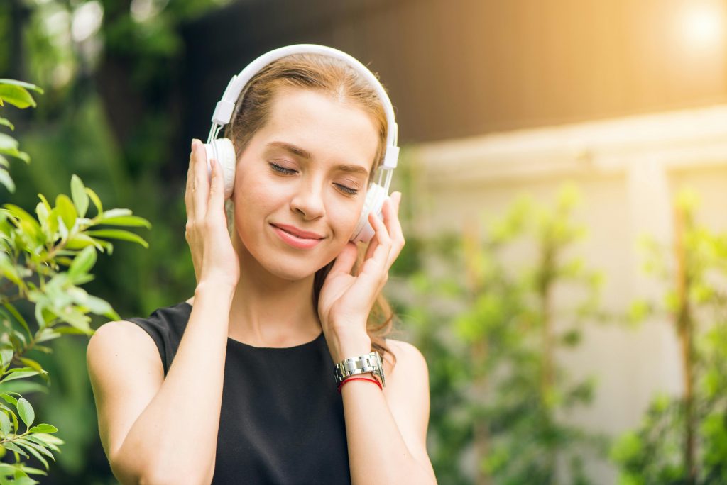 listening to music. Photo by Tirachard Kumtanom via Pexels