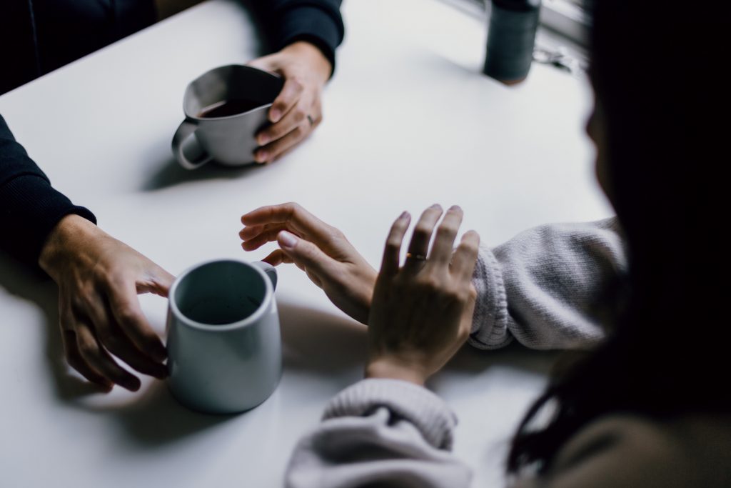 ALT TEXT: Friends drinking coffee. Photo by Priscilla Du Preez 🇨🇦 via Unsplash